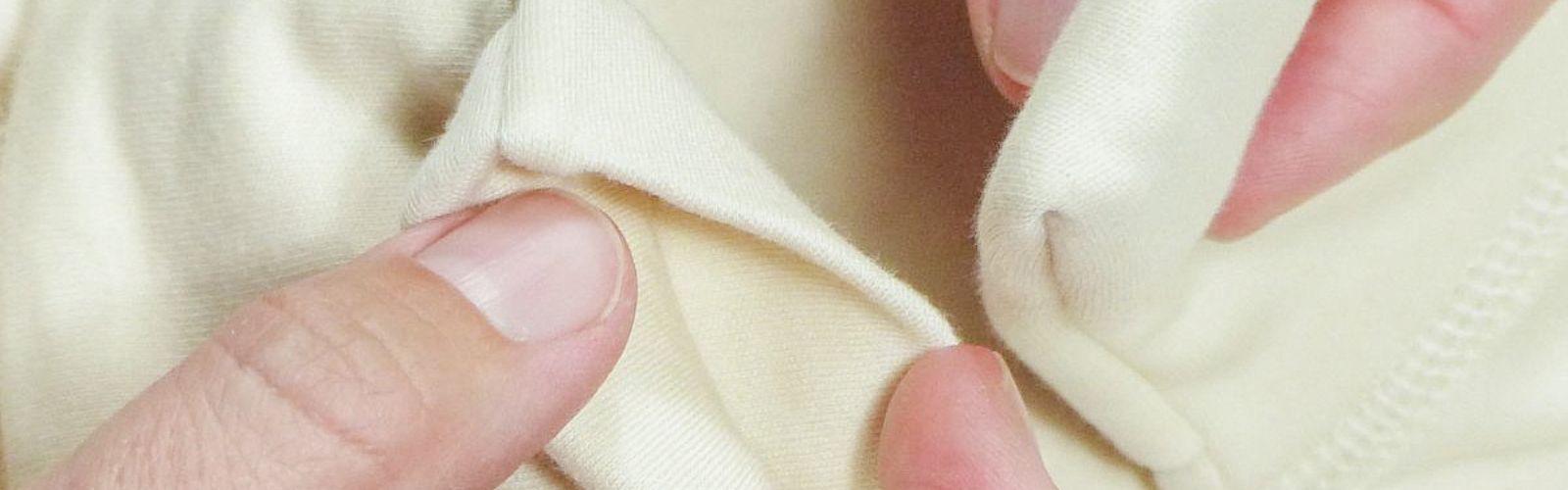 Close-up of soft, seam-free cotton fabric designed for sensitive baby skin